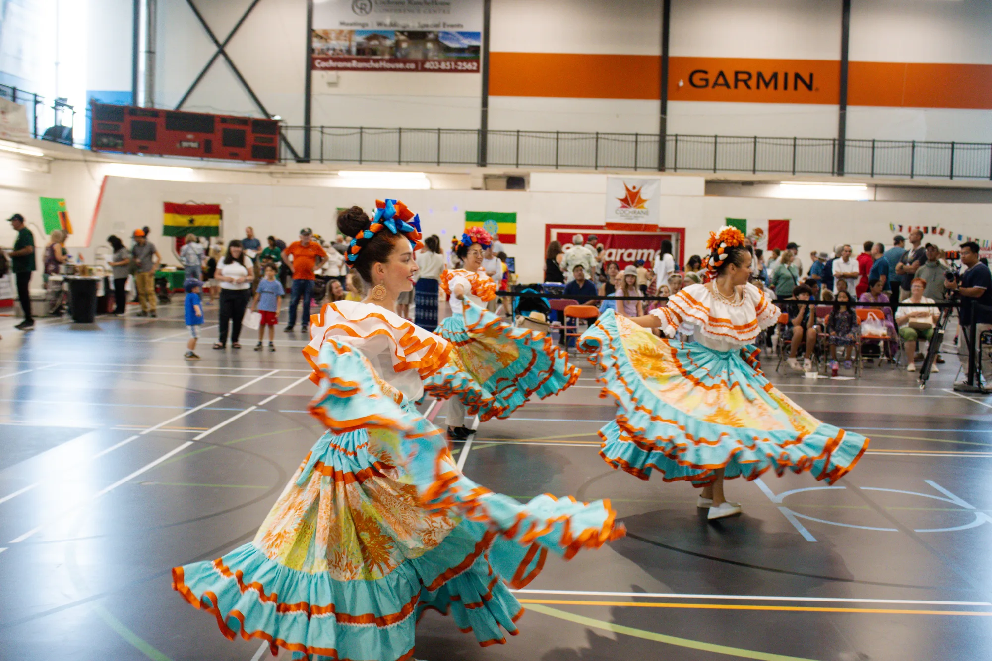 Dancers in colourful dresses performing for the crowd at CultureFest